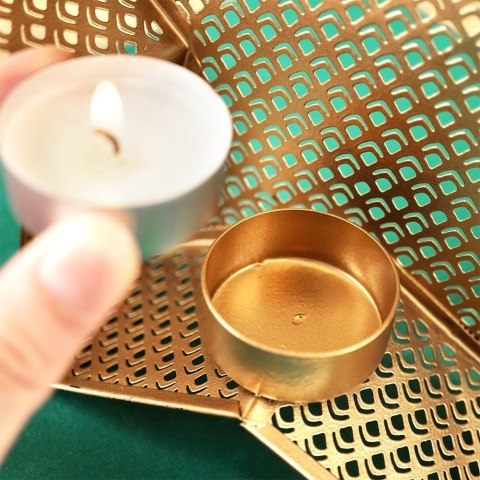 Świecznik na świeczkę tealight aluminiowy złoty czarny gwiazda 21x20 cm Świecznik na świeczkę tealight aluminiowy złoty czarny gwiazda 21x20 cm